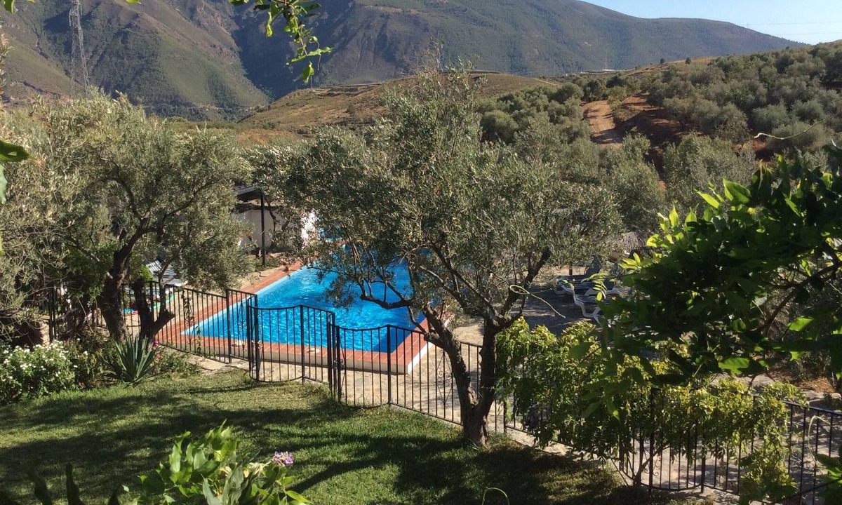 Orgiva House | Lovely farmhouse set in private olive groves with mountain views and gated pool