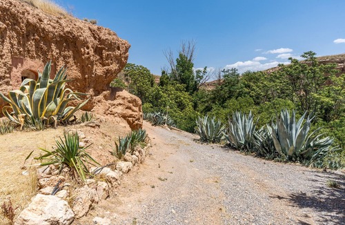 Guadix Apartment | Apartment 'Cueva La Olvidada' with Mountain View, Shared Pool and Wi-Fi